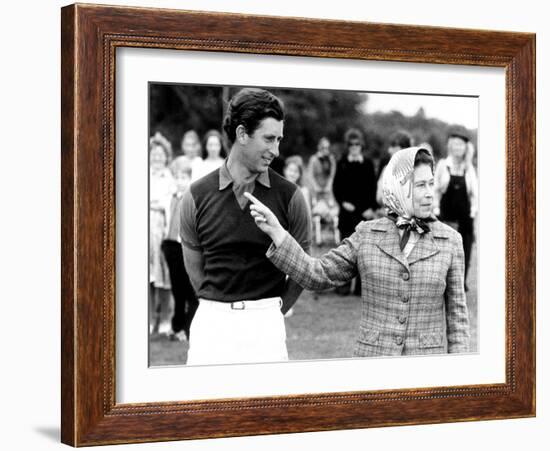 Queen Elizabeth II Shows Prince Charles Sign at a Polo Match at Windsor Great Park Points Finger-null-Framed Photographic Print