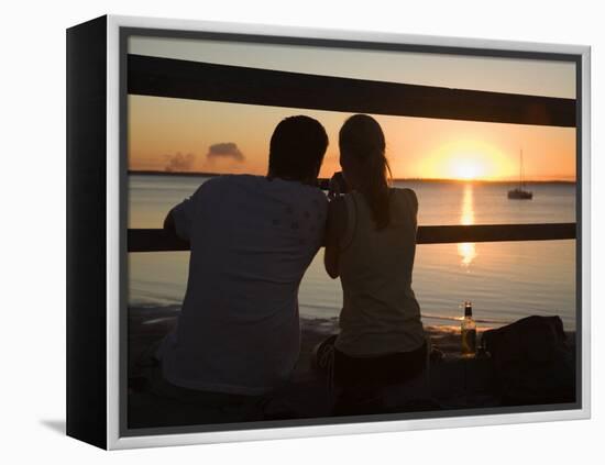 Queensland, Fraser Island, A Couple with Video Camera in Hand Watch Sunset from a Pier, Australia-Andrew Watson-Framed Premier Image Canvas