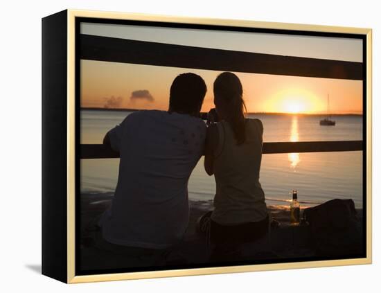 Queensland, Fraser Island, A Couple with Video Camera in Hand Watch Sunset from a Pier, Australia-Andrew Watson-Framed Premier Image Canvas