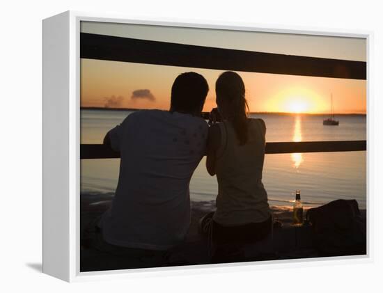 Queensland, Fraser Island, A Couple with Video Camera in Hand Watch Sunset from a Pier, Australia-Andrew Watson-Framed Premier Image Canvas