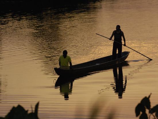 Quichua Indians Poling Dugout Canoe, Amazon Rain Forest 