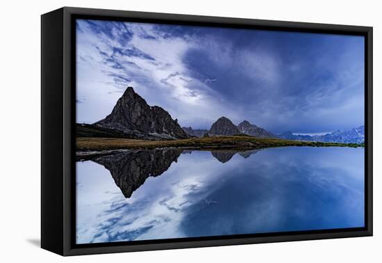 Ra Gusela and Tofane mountain peaks reflected in water under the cloudy sky at dusk-Roberto Moiola-Framed Premier Image Canvas