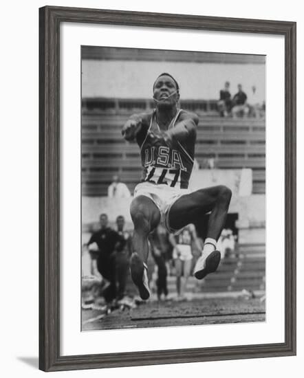 Rafer Johnson in Decathlon Broad Jump in Olympics-James Whitmore-Framed Premium Photographic Print