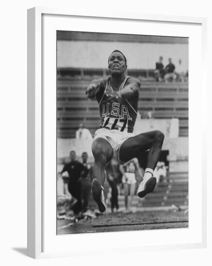 Rafer Johnson in Decathlon Broad Jump in Olympics-James Whitmore-Framed Premium Photographic Print