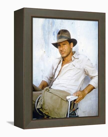 RAIDERS OF THE LOST ARK, 1981 On the set, Harrison Ford (photo)-null-Framed Stretched Canvas