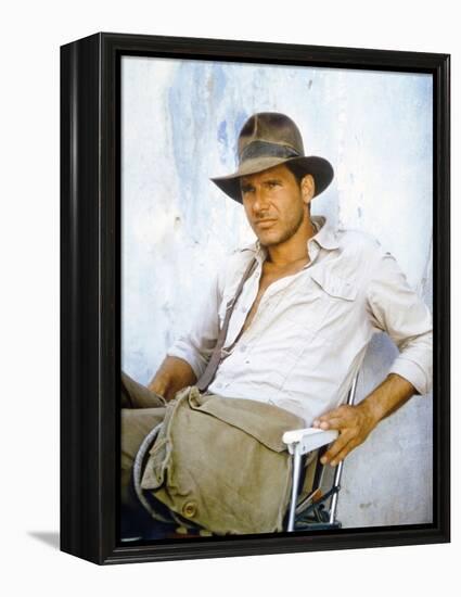 RAIDERS OF THE LOST ARK, 1981 On the set, Harrison Ford (photo)-null-Framed Stretched Canvas