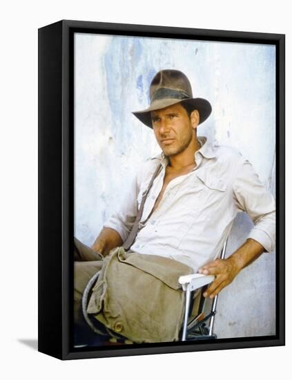 RAIDERS OF THE LOST ARK, 1981 On the set, Harrison Ford (photo)-null-Framed Stretched Canvas