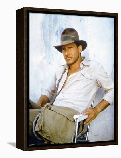 RAIDERS OF THE LOST ARK, 1981 On the set, Harrison Ford (photo)-null-Framed Stretched Canvas