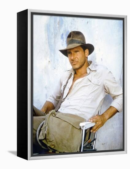 RAIDERS OF THE LOST ARK, 1981 On the set, Harrison Ford (photo)-null-Framed Stretched Canvas