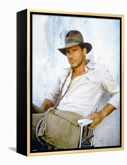 RAIDERS OF THE LOST ARK, 1981 On the set, Harrison Ford (photo)-null-Framed Stretched Canvas