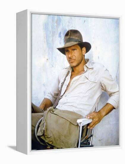 RAIDERS OF THE LOST ARK, 1981 On the set, Harrison Ford (photo)-null-Framed Stretched Canvas