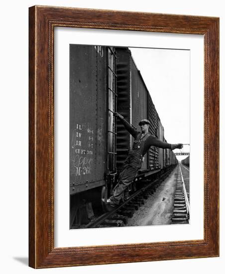 Railroad Brakeman George Christian, Swinging His Arm Horizontally to Signal to Locomotive Engineer-Alfred Eisenstaedt-Framed Photographic Print