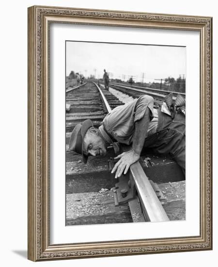 Railroad Section Boss D. D. Pittman Checking to Make Sure New Rail is properly level-Alfred Eisenstaedt-Framed Photographic Print