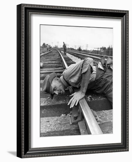 Railroad Section Boss D. D. Pittman Checking to Make Sure New Rail is properly level-Alfred Eisenstaedt-Framed Photographic Print