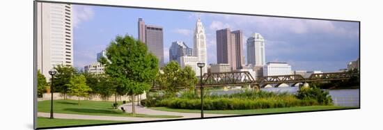 Railway bridge across a river with skyscrapers in the background, Scioto River, Columbus, Ohio, USA-null-Mounted Photographic Print