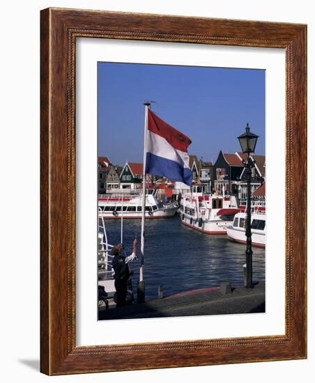 Raising the Dutch Flag by the Harbour, Volendam, Ijsselmeer, Holland-I Vanderharst-Framed Photographic Print