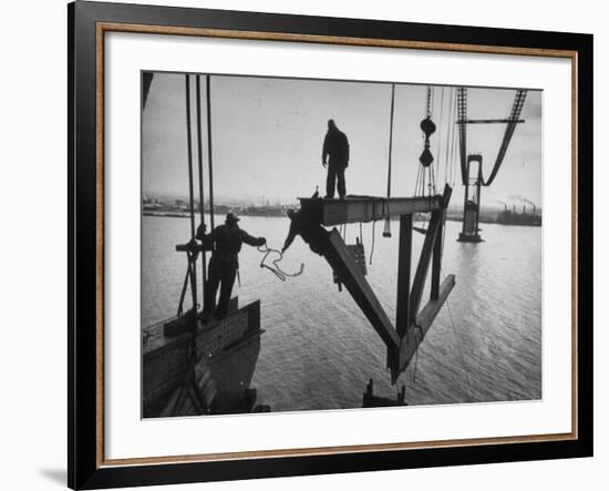 Raising the Truss, Men of the Raising Gang Ride the Swinging Steel 160 Feet Above the Water-Peter Stackpole-Framed Photographic Print