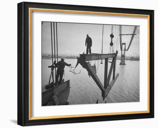 Raising the Truss, Men of the Raising Gang Ride the Swinging Steel 160 Feet Above the Water-Peter Stackpole-Framed Photographic Print