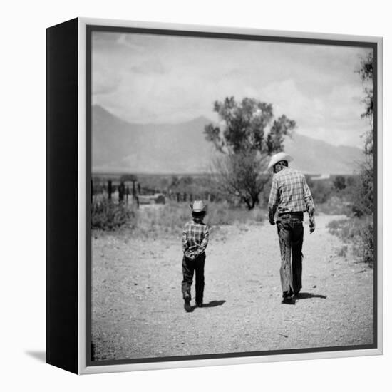 Rancher James A. Shugart Walking a Dusty Road with Son James Jr-Allan Grant-Framed Premier Image Canvas