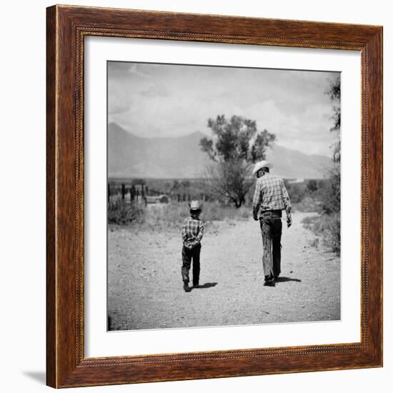 Rancher James A. Shugart Walking a Dusty Road with Son James Jr-Allan Grant-Framed Photographic Print