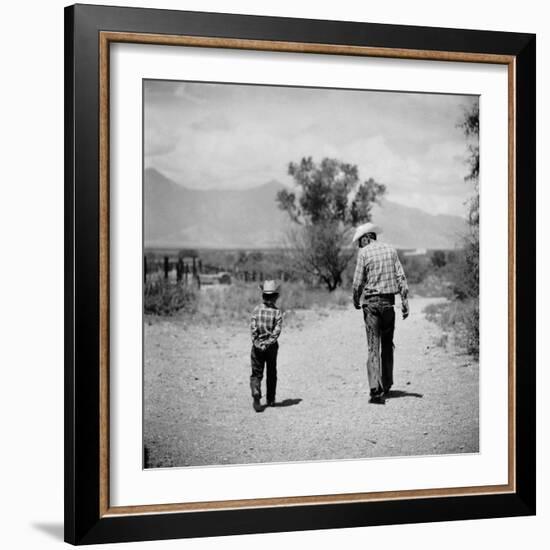 Rancher James A. Shugart Walking a Dusty Road with Son James Jr-Allan Grant-Framed Photographic Print