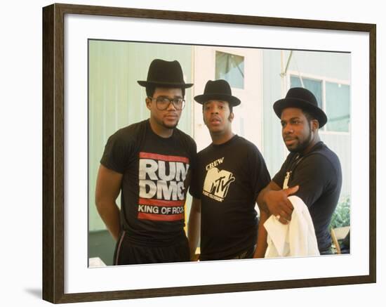 Rap Group Run DMC: Darryl McDaniels, Joe Simmons and Jason Mizell-David Mcgough-Framed Premium Photographic Print