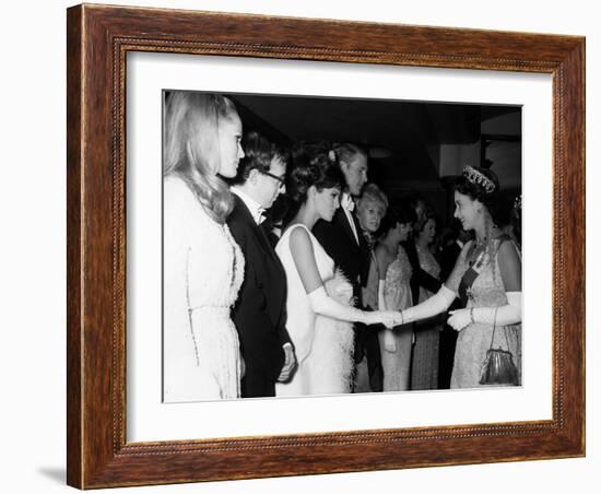 Raquel Welch Meets Queen Elizabeth in 1966 with Woody Allen and Ursula Andress-null-Framed Photographic Print