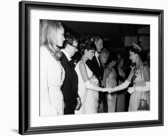 Raquel Welch Meets Queen Elizabeth in 1966 with Woody Allen and Ursula Andress-null-Framed Photographic Print