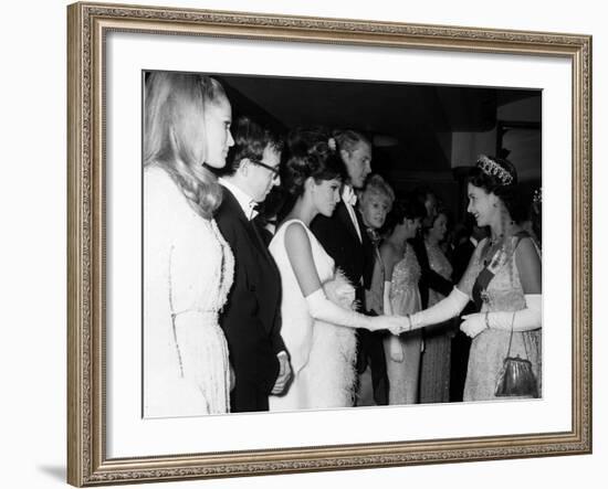 Raquel Welch Meets Queen Elizabeth in 1966 with Woody Allen and Ursula Andress-null-Framed Photographic Print