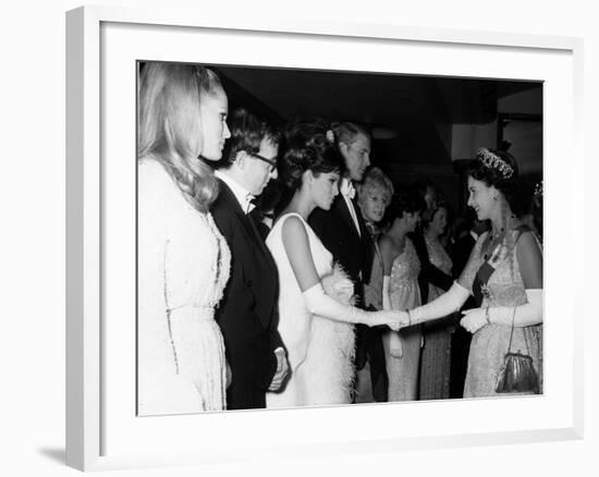 Raquel Welch Meets Queen Elizabeth in 1966 with Woody Allen and Ursula Andress-null-Framed Photographic Print