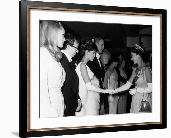 Raquel Welch Meets Queen Elizabeth in 1966 with Woody Allen and Ursula Andress-null-Framed Photographic Print