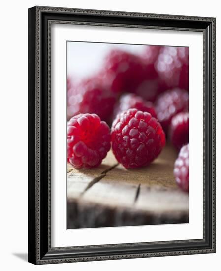 Raspberries on a Wooden Surface-Martina Schindler-Framed Photographic Print