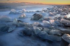 Pieces of glacial ice over black sand being washed by waves, Iceland-Raul Touzon-Photographic Print