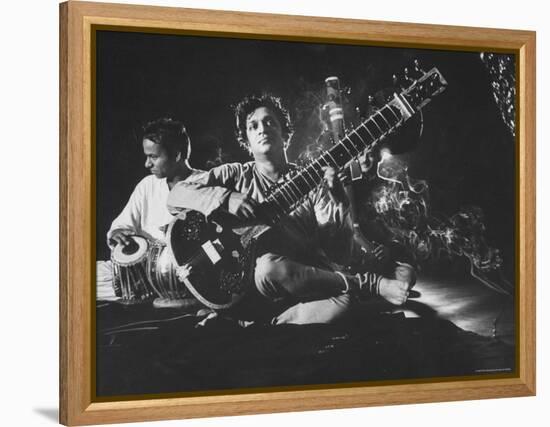 Ravi Shankar Passionately Playing the Sitar-Paul Schutzer-Framed Premier Image Canvas