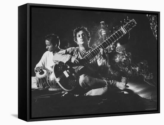 Ravi Shankar Passionately Playing the Sitar-Paul Schutzer-Framed Premier Image Canvas