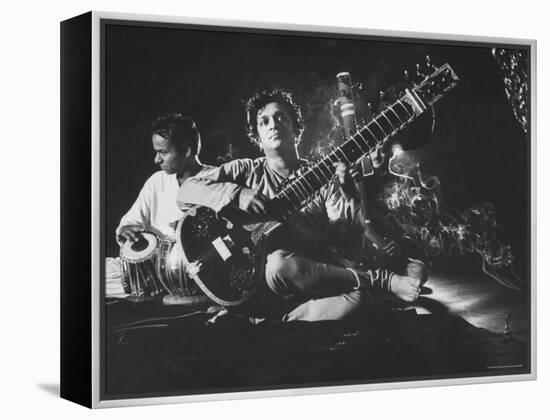 Ravi Shankar Passionately Playing the Sitar-Paul Schutzer-Framed Premier Image Canvas