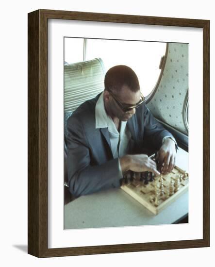 Ray Charles Playing Chess on the Tour Bus-null-Framed Photo