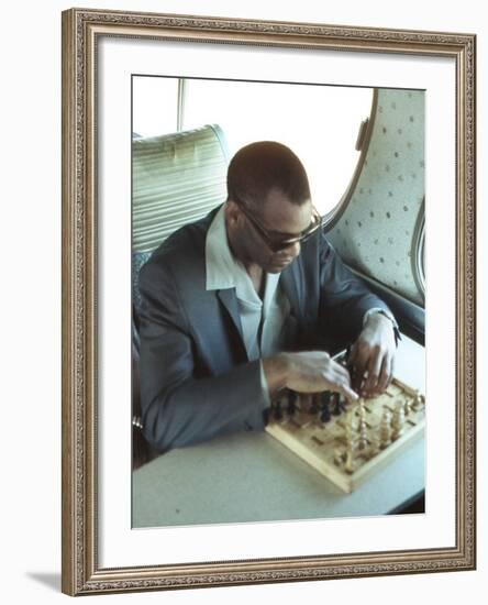 Ray Charles Playing Chess on the Tour Bus-null-Framed Photo