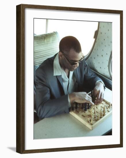 Ray Charles Playing Chess on the Tour Bus-null-Framed Photo