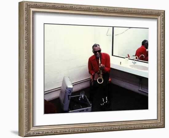 Ray Charles with His Alto Saxophone Backstage-null-Framed Photo