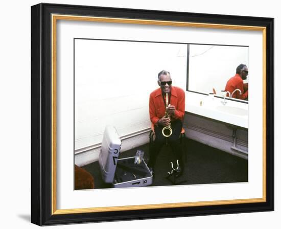 Ray Charles with His Alto Saxophone Backstage-null-Framed Photo