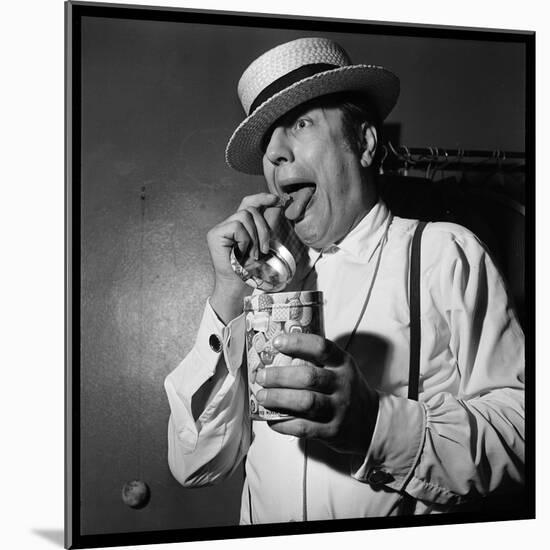 Raymond Devos Eating a Candy-Thérese Begoin-Mounted Photographic Print