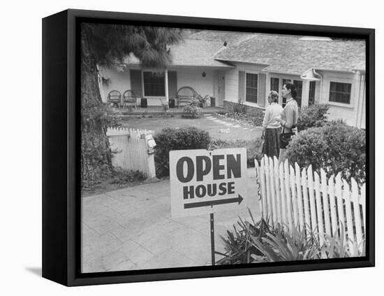 Realtor Pat Devault Showing a House to Her Clients-J^ R^ Eyerman-Framed Premier Image Canvas