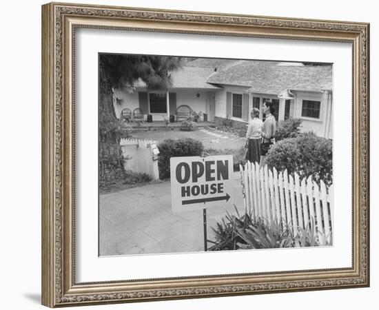 Realtor Pat Devault Showing a House to Her Clients-J^ R^ Eyerman-Framed Photographic Print