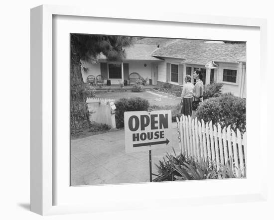 Realtor Pat Devault Showing a House to Her Clients-J^ R^ Eyerman-Framed Photographic Print