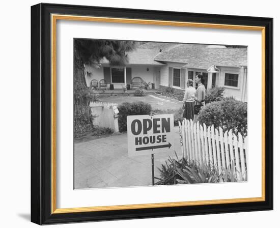 Realtor Pat Devault Showing a House to Her Clients-J^ R^ Eyerman-Framed Photographic Print