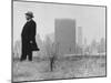 Realtor William J. Zeckendorf, Standing in the Wind Fields Located on the Outskirts of the City-John Loengard-Mounted Premium Photographic Print