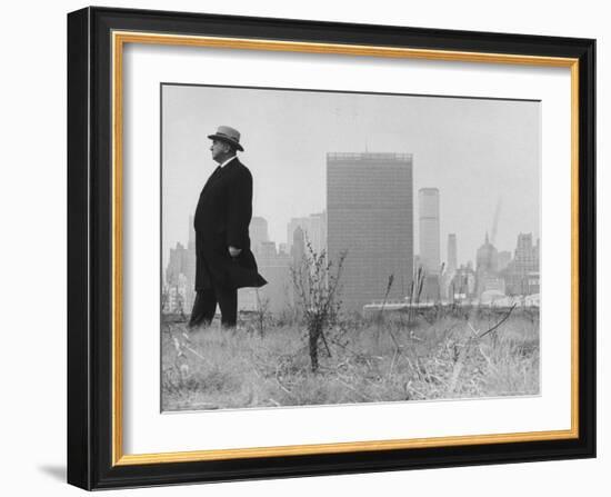 Realtor William J. Zeckendorf, Standing in the Wind Fields Located on the Outskirts of the City-John Loengard-Framed Premium Photographic Print