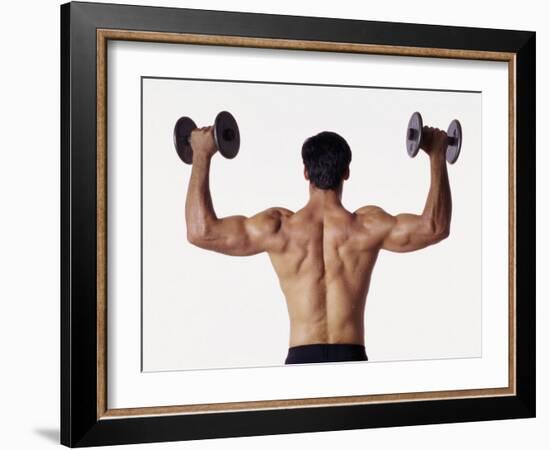 Rear View of a Man Holding Up Dumbbells-null-Framed Photographic Print