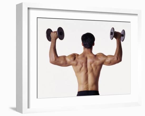 Rear View of a Man Holding Up Dumbbells-null-Framed Photographic Print